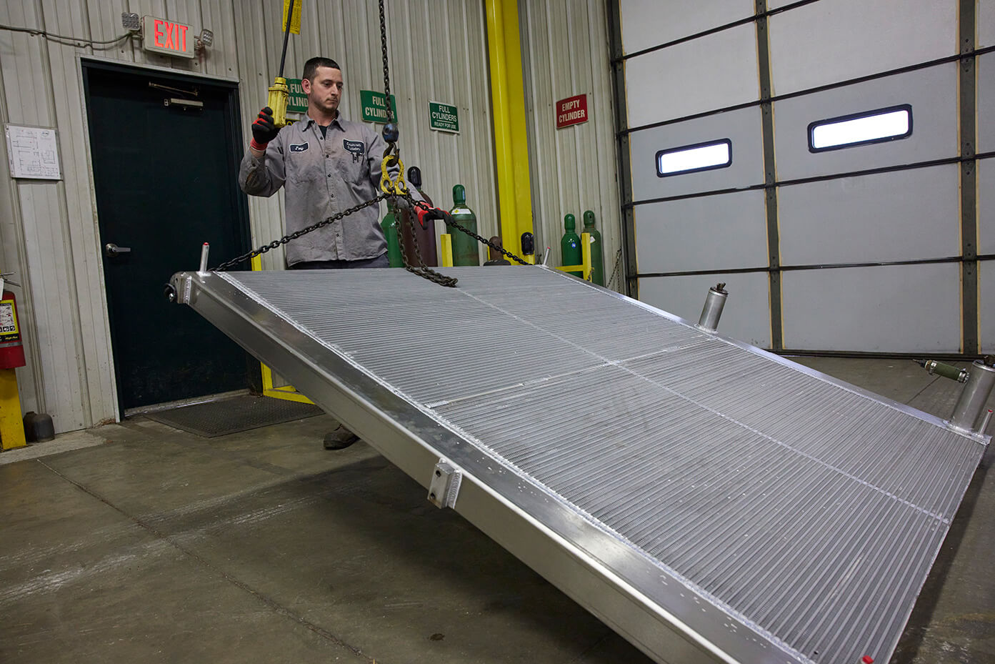 A worker hauling a heat transfer product